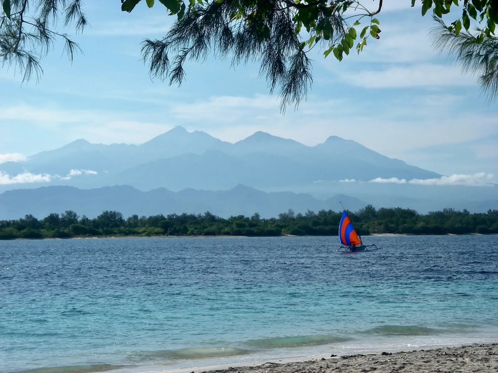 View from Gili Trawangan toward Gili Meno, with the Rinjani massif in the distance.